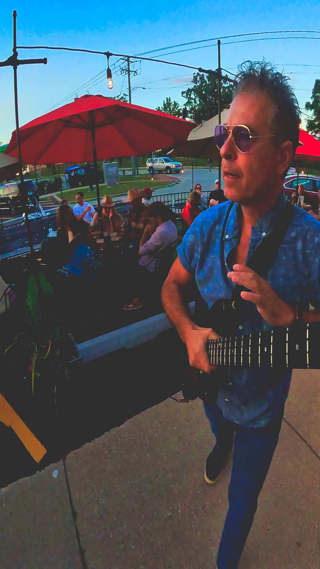 Nick Sanzeri performing live with bass and microphone